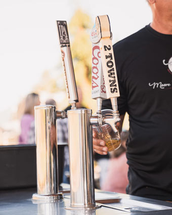 Close-up of beer taps at Moore Family Vineyards event